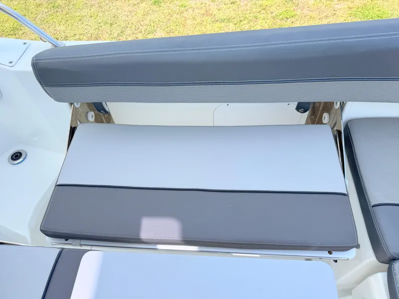 Slide: The Image of 2018 Jeanneau Leader 9.0 WA boat seating with gray cushions and white accents. - 29