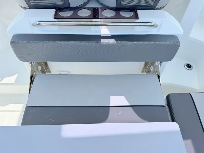 Slide: The Image of 2018 Jeanneau Leader 9.0 WA boat seating area with cup holders and cushioned seats. - 30