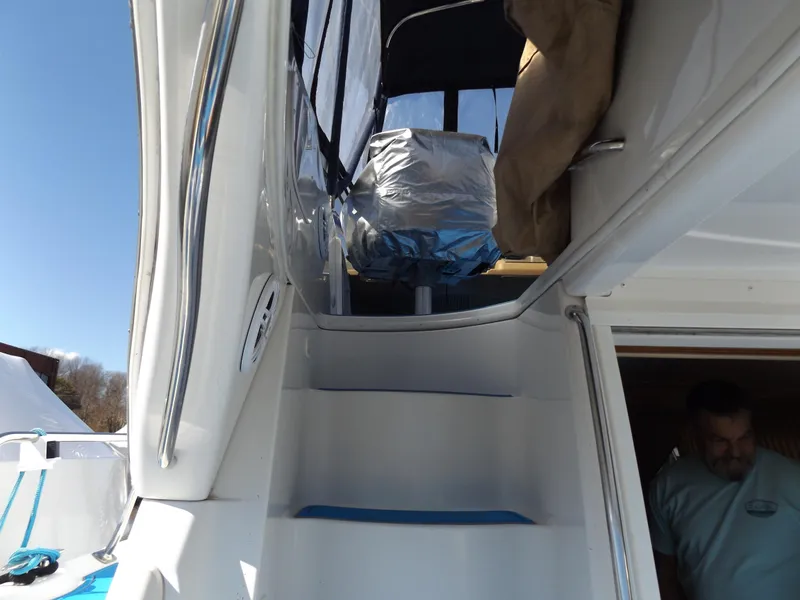 Slide: The Image of 2003 Carver 360 Sport Sedan boat stairs leading to upper deck. - 17