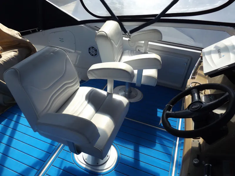 Slide: The Image of Interior of 2003 Carver 360 Sport Sedan with white seats and blue flooring. - 23