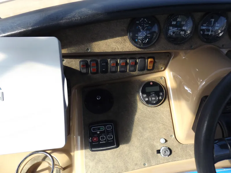 Slide: The Image of Control panel of a 2003 Carver 360 Sport Sedan boat with gauges and switches. - 25