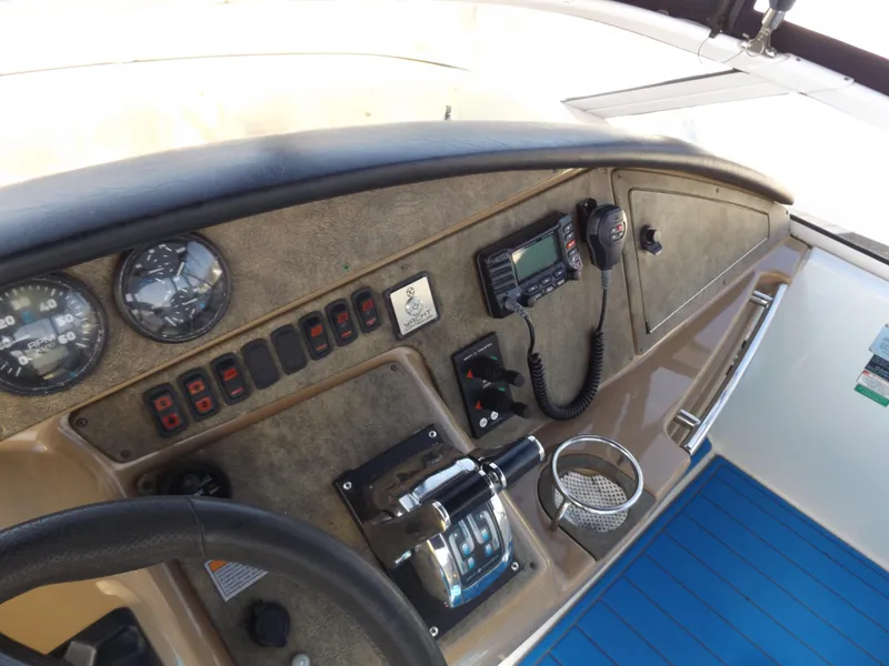 Slide: The Image of 2003 Carver 360 Sport Sedan helm with gauges, controls, and communication equipment. - 26