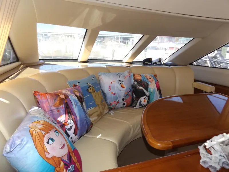 Slide: The Image of Interior of 2003 Carver 360 Sport Sedan with themed cushions on a leather sofa. - 30