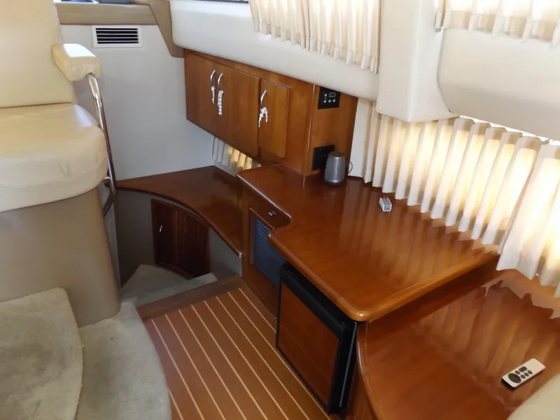 Slide: The Image of Interior of 2003 Carver 360 Sport Sedan with wood cabinetry and seating area. - 31