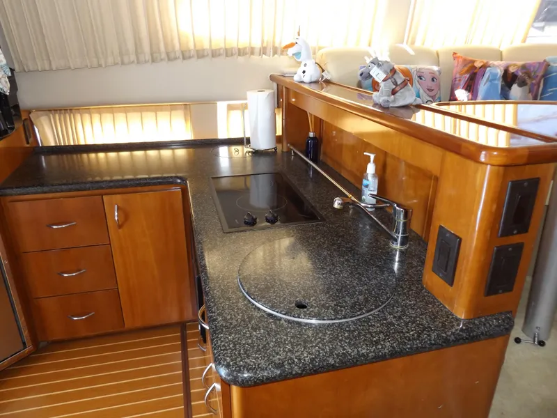 Slide: The Image of Luxurious kitchen in 2003 Carver 360 Sport Sedan yacht with granite countertops. - 33