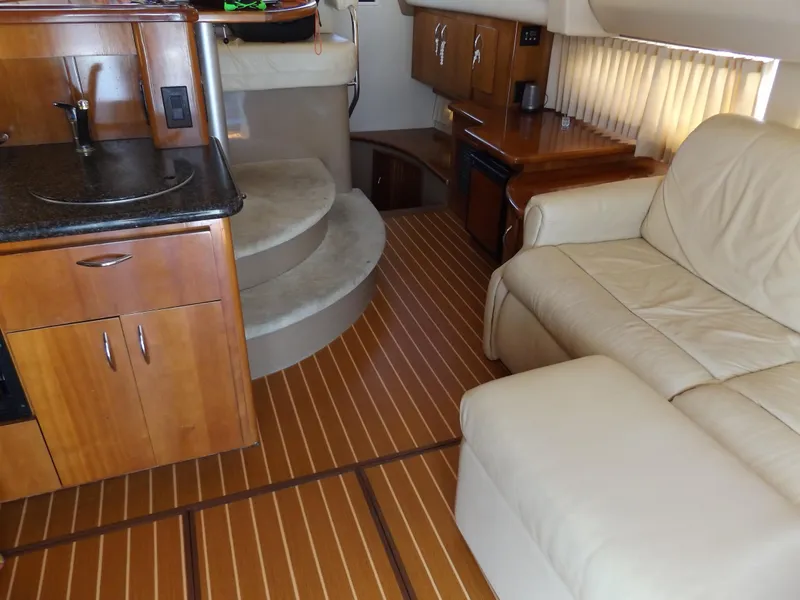 Slide: The Image of Interior of 2003 Carver 360 Sport Sedan with wood flooring and beige seating. - 37