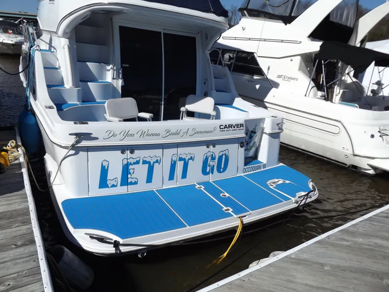 Slide: The Image of 2003 Carver 360 Sport Sedan named "Let It Go" docked at a marina. - 40