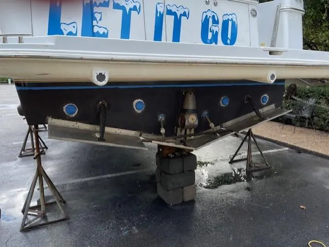 Slide: The Image of 2003 Carver 360 Sport Sedan on stands, rear view with "Let It Go" text. - 44