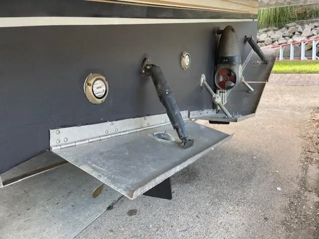 Slide: The Image of 2003 Carver 360 Sport Sedan stern with trim tabs and exhaust outlets. - 45