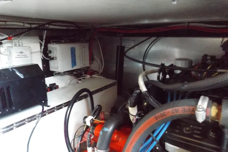 Slide: The Image of Engine room of a 2003 Carver 360 Sport Sedan with visible wiring and components. - 47