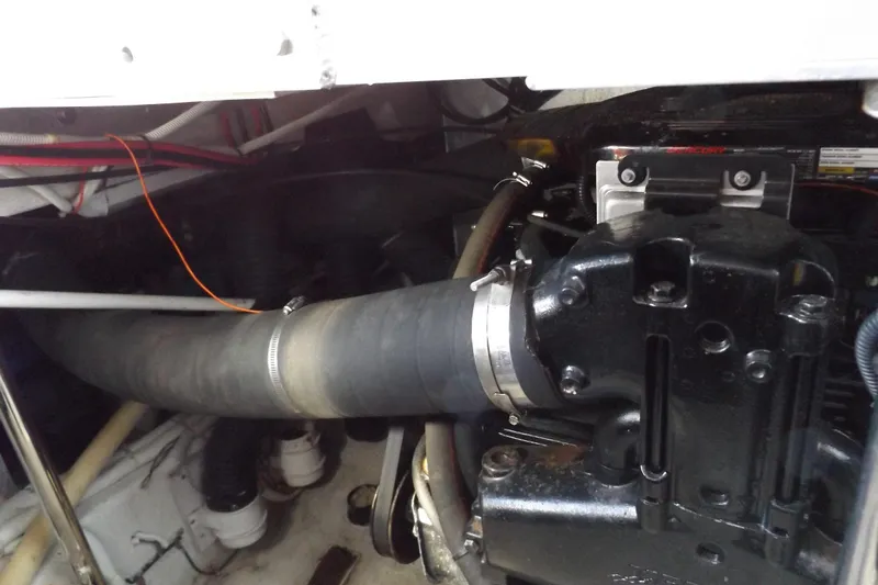 Slide: The Image of Engine compartment of a 2003 Carver 360 Sport Sedan with visible hoses and components. - 49