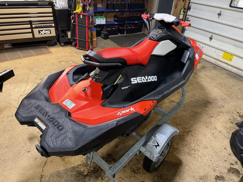 Slide: The Image of 2015 Sea-Doo Spark 3up 900 H.O. ACE jet ski in a garage setting. - 3