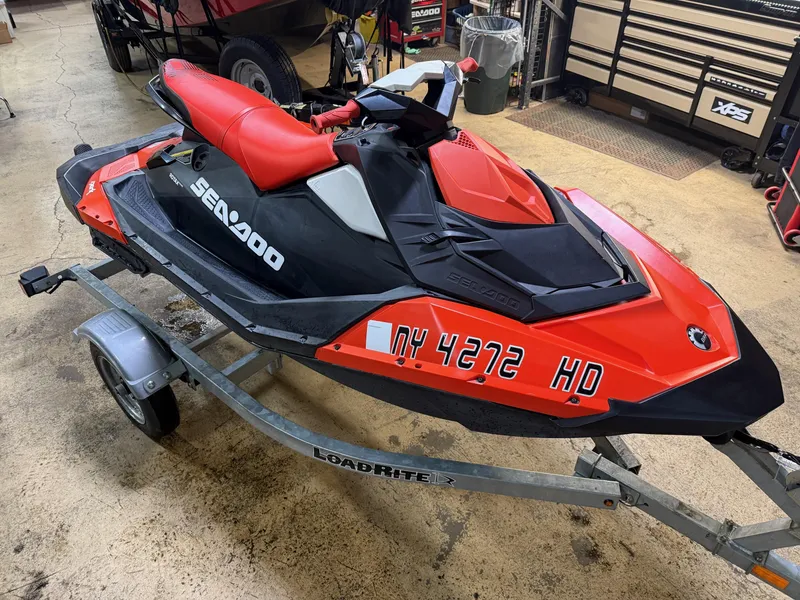 Slide: The Image of 2015 Sea-Doo Spark 3up 900 H.O. ACE on trailer in garage setting. - 4