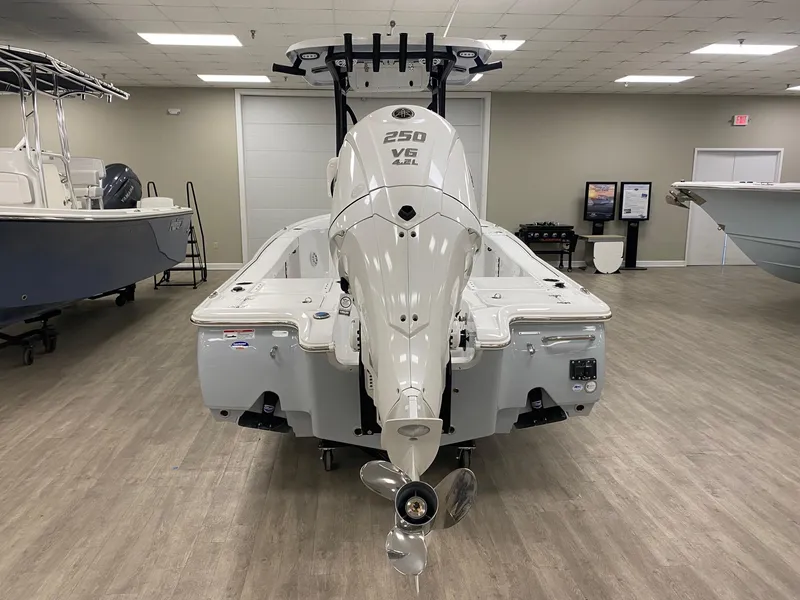 Slide: The Image of 2025 Sea Hunt BX 22 BR boat with powerful 250 V6 engine in showroom. - 5