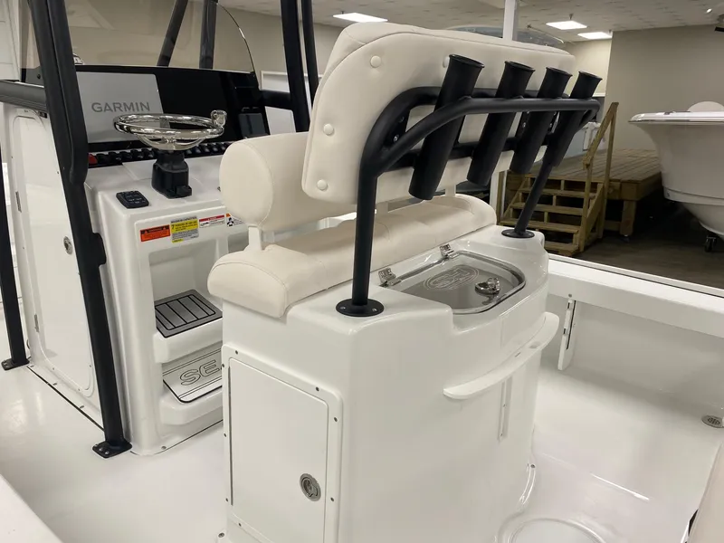 Slide: The Image of 2025 Sea Hunt BX 22 BR boat interior with Garmin system and rod holders. - 7