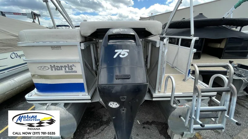 Slide: The Image of 2007 Harris Sunliner 220 pontoon boat with 75 HP motor, displayed at Marine Center Indiana. - 1