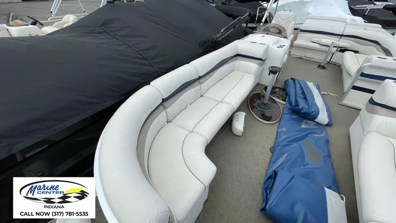 Slide: The Image of 2007 Harris Sunliner 220 pontoon boat with white seating and covered sections. - 3