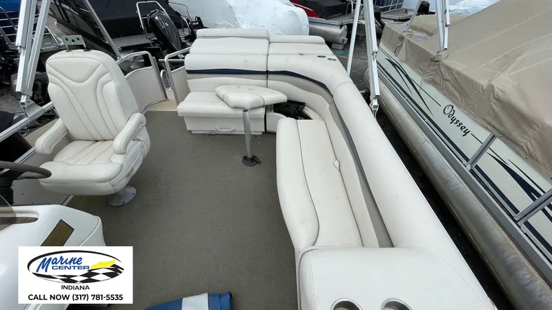 Slide: The Image of 2007 Harris Sunliner 220 pontoon boat interior with white seating and steering chair. - 5