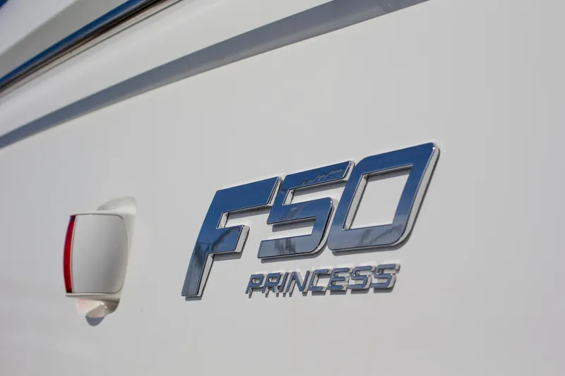 Slide: The Image of 2022 Princess F50 logo on white yacht exterior. - 16