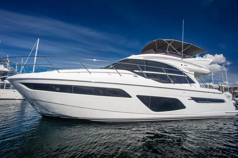 Slide: The Image of Luxury 2022 Princess F50 yacht on water under clear blue sky. - 18