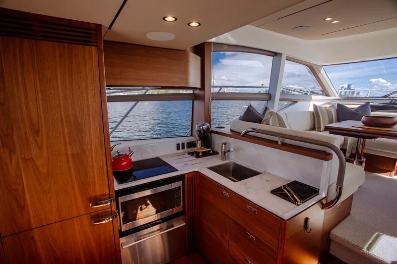 Slide: The Image of Luxurious 2022 Princess F50 yacht interior with modern kitchen and scenic ocean view. - 20