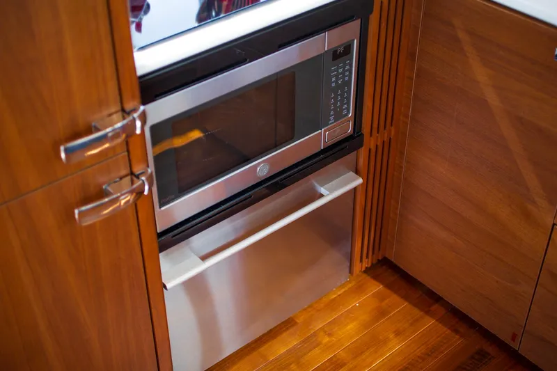 Slide: The Image of Modern kitchen with built-in microwave in a 2022 Princess F50 yacht. - 21