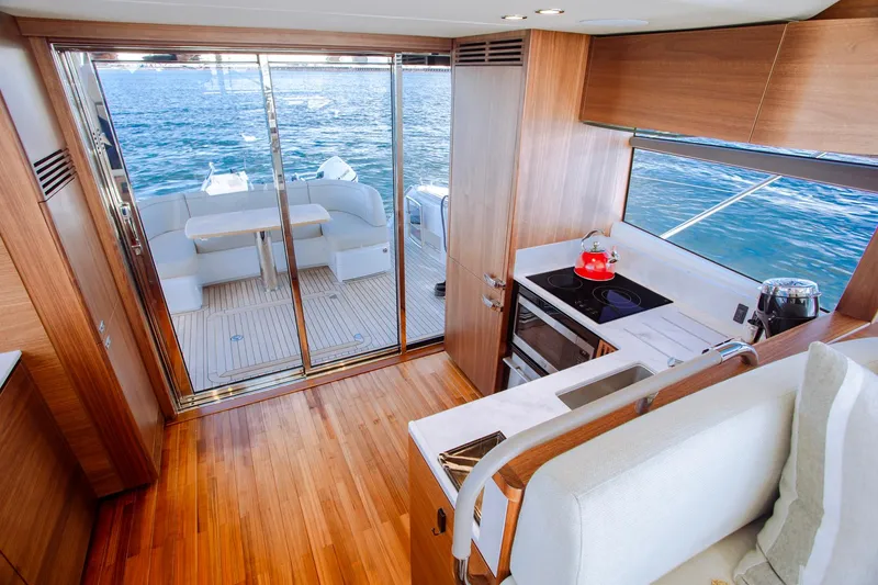 Slide: The Image of Luxurious 2022 Princess F50 yacht interior with modern kitchen and ocean view. - 23