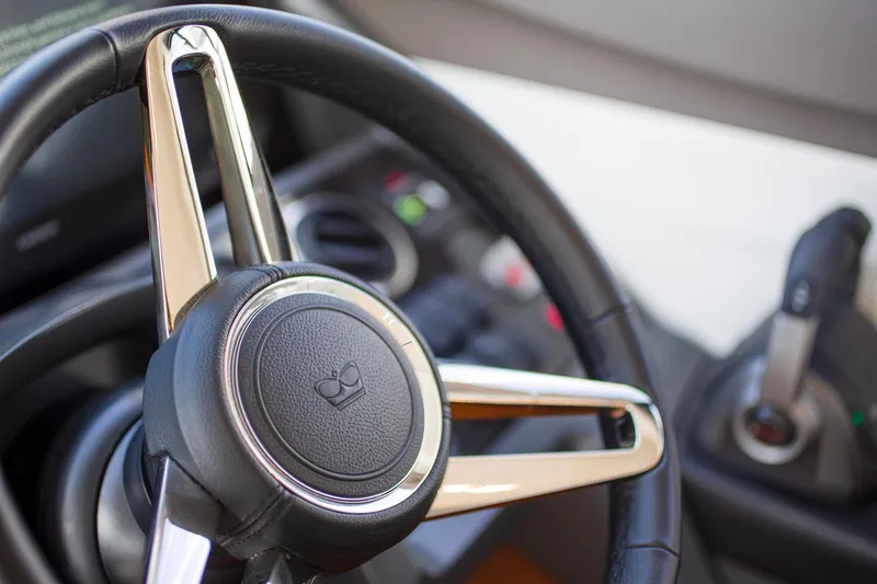 Slide: The Image of Steering wheel of a 2022 Princess F50 yacht, featuring sleek design and modern controls. - 31