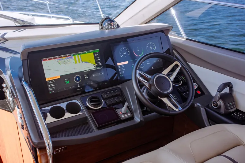 Slide: The Image of Cockpit of 2022 Princess F50 yacht with advanced navigation displays and controls. - 33