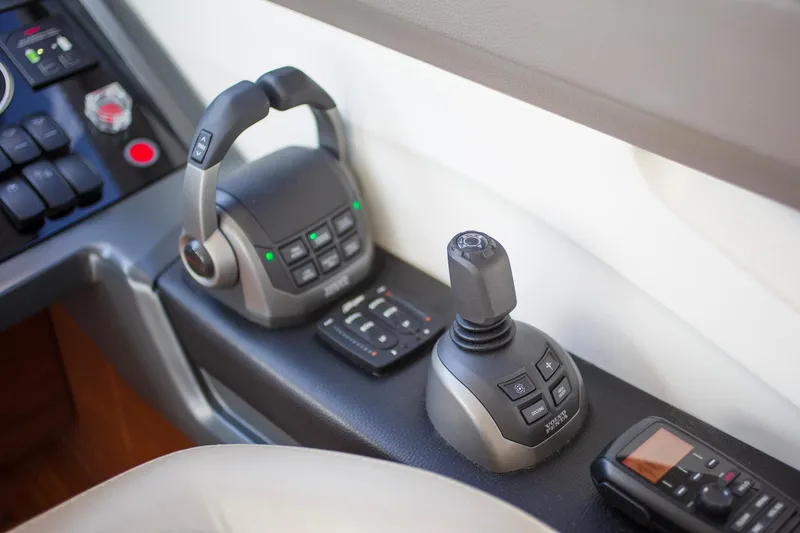 Slide: The Image of Control panel of a 2022 Princess F50 yacht with joystick and throttle controls. - 34