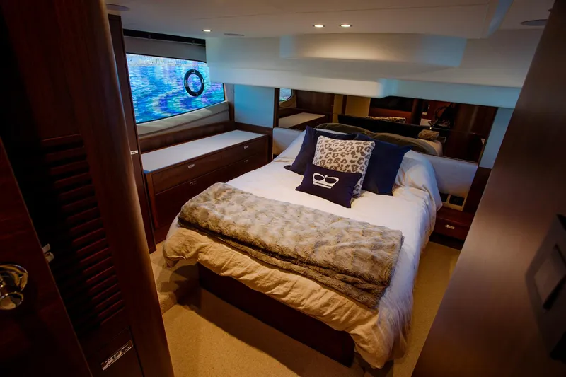 Slide: The Image of Luxurious bedroom interior of 2022 Princess F50 yacht with elegant bedding and wood accents. - 37