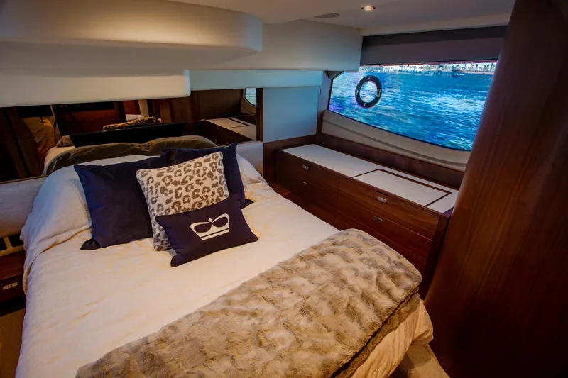 Slide: The Image of Luxurious bedroom interior of 2022 Princess F50 yacht with elegant bedding and ocean view. - 38