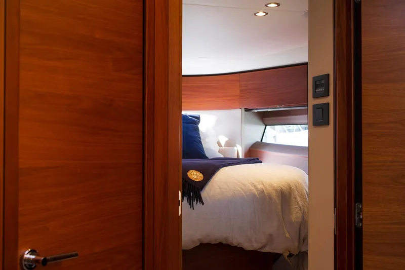 Slide: The Image of Luxurious cabin interior of 2022 Princess F50 yacht with cozy bedding. - 44