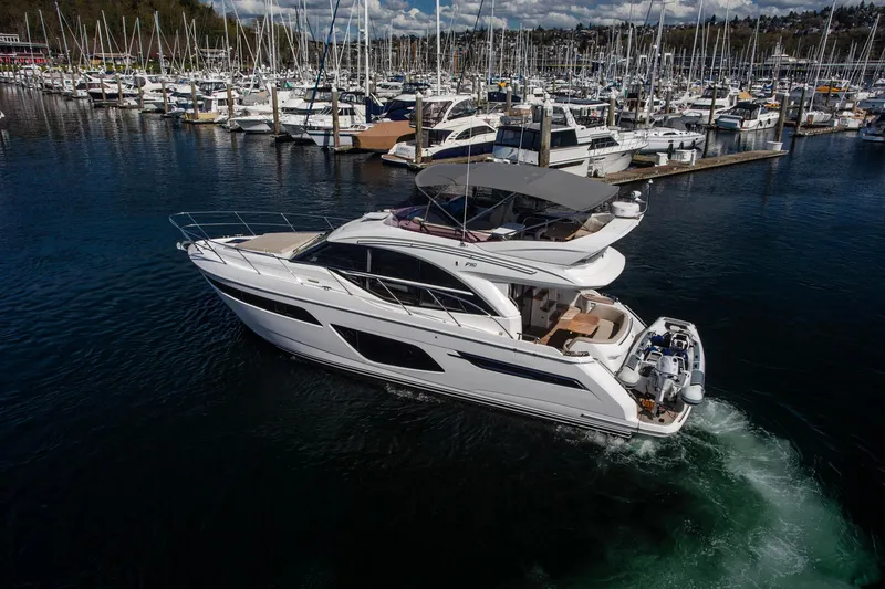 Slide: The Image of Luxurious 2022 Princess F50 yacht cruising in a bustling marina. - 6