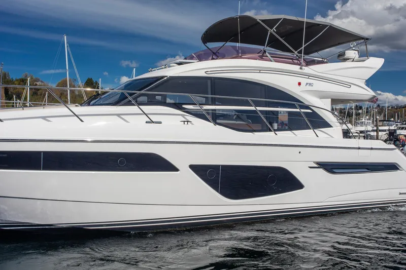 Slide: The Image of Luxury 2022 Princess F50 yacht on water, showcasing sleek design and modern features. - 7