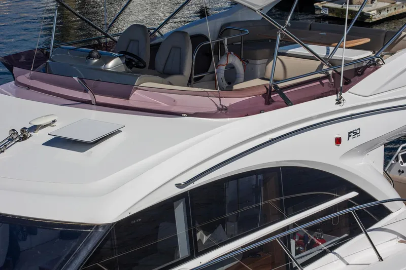 Slide: The Image of Luxury 2022 Princess F50 yacht with sleek design and spacious deck. - 9