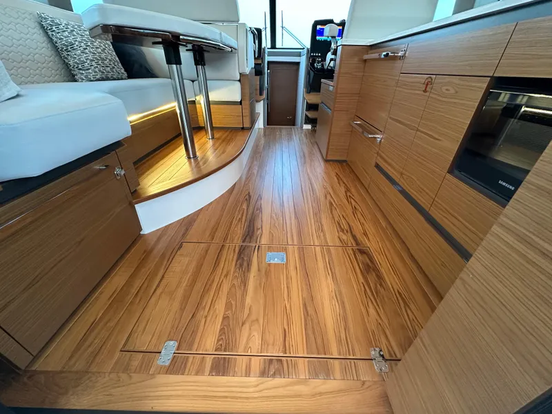 Slide: The Image of Luxurious interior of 2024 Tiara Yachts 48 LE with elegant wood flooring. - 12