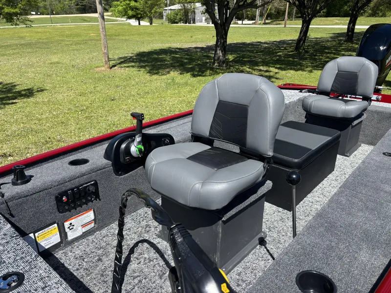 Slide: The Image of 2025 Tracker Panfish 17 boat interior with gray seating and control panel. - 11