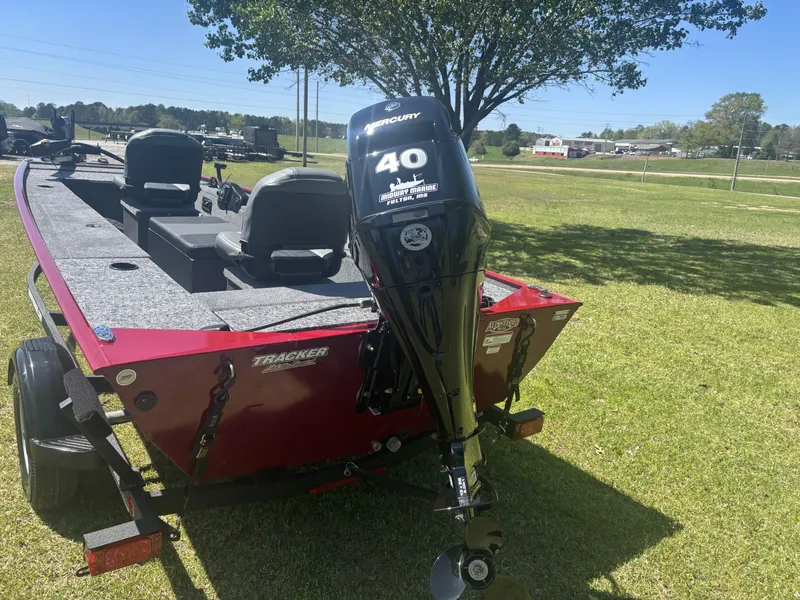 Slide: The Image of 2025 Tracker Panfish 17 boat with Mercury 40 engine on grassy area. - 7