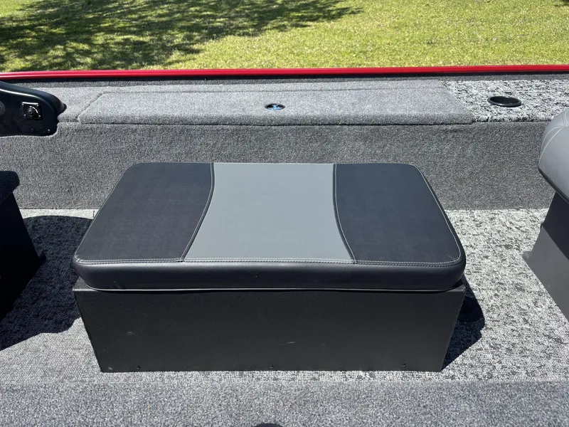 Slide: The Image of 2025 Tracker Panfish 17 boat seat, gray and black upholstery, outdoor setting. - 9