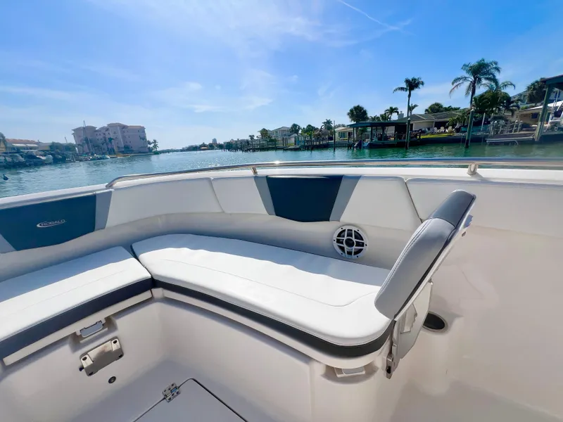 Slide: The Image of 2022 Robalo R272 Center Console boat interior with waterfront view. - 25
