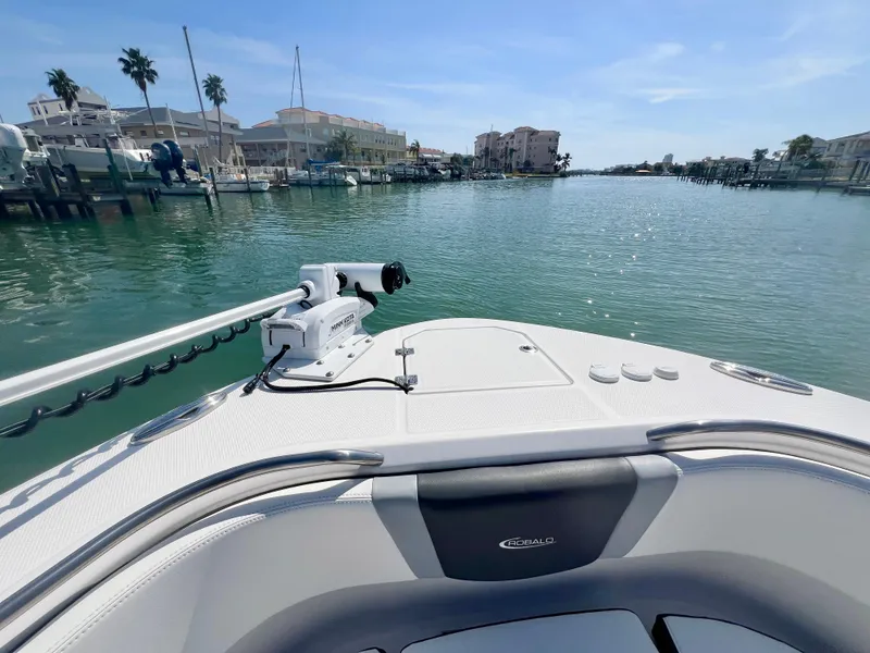 Slide: The Image of 2022 Robalo R272 Center Console boat on a scenic waterfront. - 26