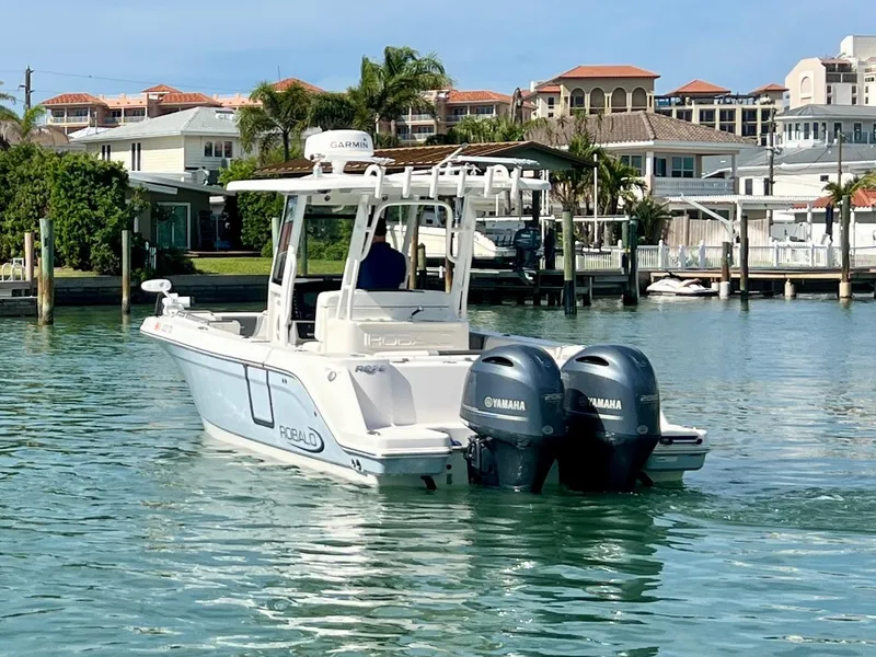 Slide: The Image of 2022 Robalo R272 Center Console boat with twin Yamaha engines on calm water. - 3