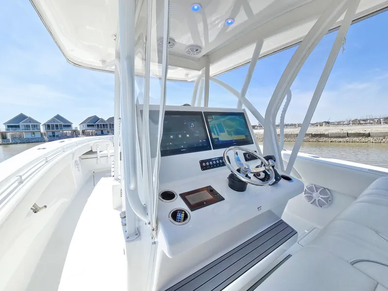 Slide: The Image of 2024 SeaHunter 35 Tournament boat cockpit with advanced navigation system and sleek design. - 19