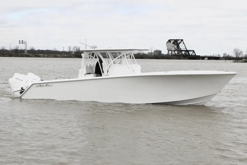 Slide: The Image of 2024 SeaHunter 35 Tournament boat on calm water, side view. - 2