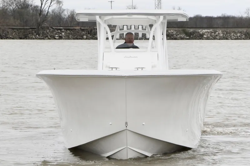 Slide: The Image of 2024 SeaHunter 35 Tournament boat on water, front view, overcast day. - 3
