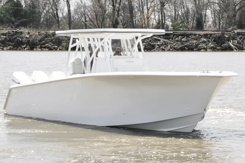 Slide: The Image of 2024 SeaHunter 35 Tournament boat on calm water, showcasing sleek design and modern features. - 8