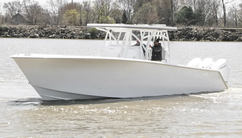 Slide: The Image of 2024 SeaHunter 35 Tournament boat cruising on a calm river. - 9