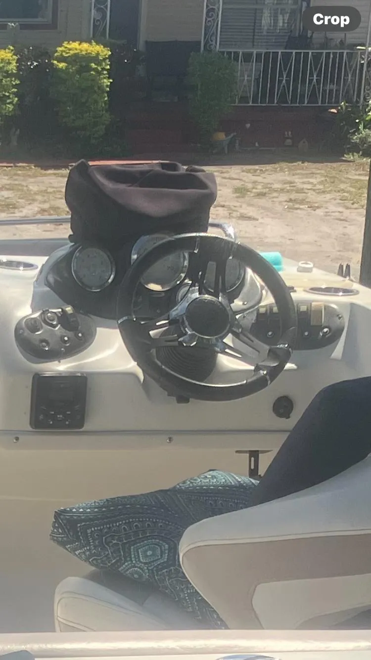 Slide: The Image of 2018 Starcraft Limited 2000 OB Fish boat dashboard with steering wheel and controls. - 11