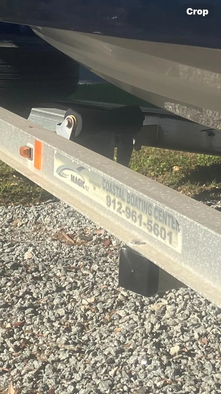 Slide: The Image of Trailer for 2018 Starcraft Limited 2000 OB Fish boat on gravel surface. - 12